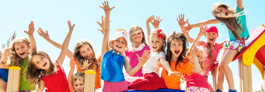 Happy Children Playing on Playground for Summer School.
