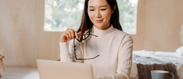 A business professional working on a laptop — researching the best commercial insurance in Ontario.