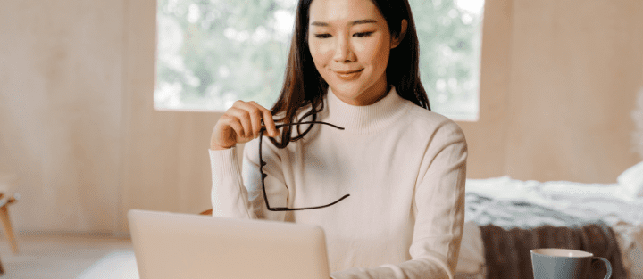 A business professional working on a laptop — researching the best commercial insurance in Ontario.