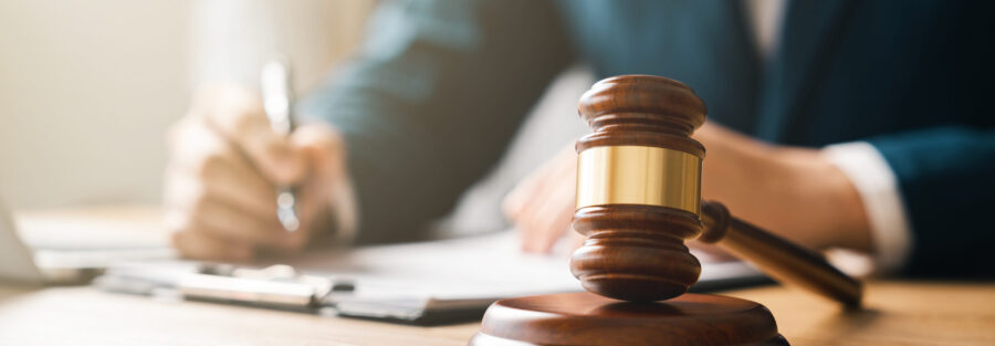 Justice concept, male judge doing report papers in courtroom, fair trial, drafting new law to modern era.